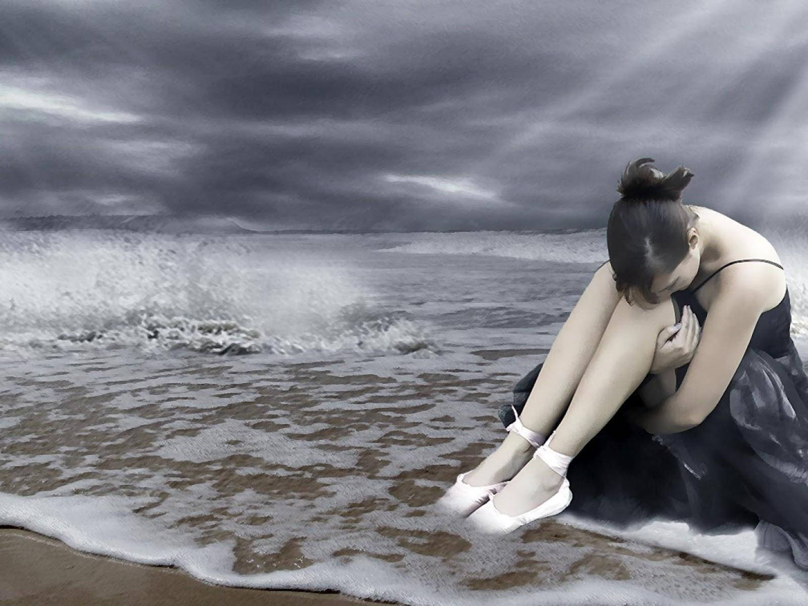 Young Woman Reflecting On Break Up At The Beach Wallpaper